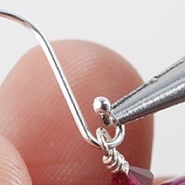 Attaching wrapped loop to earwire